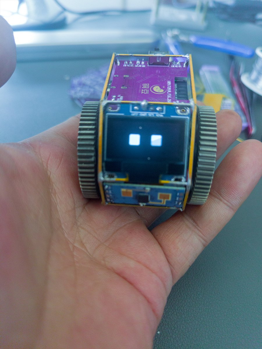 Real TongDou prototype held in a hand to show its compact size